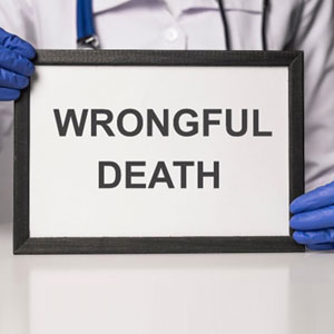 A doctor holding a framed sign with the word "wrongful death" written on it