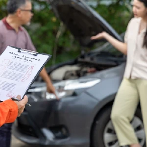 Filing a car accident insurance claim form after a vehicle collision